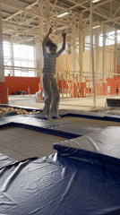 Gymnast practices backflips at indoor trampoline facility in Krasnoyarsk