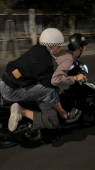 Two riders share nighttime motorcycle journey in Đà Nẵng