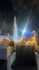 Illuminated fountain operates at night in Barakin Lerawi, Nigeria