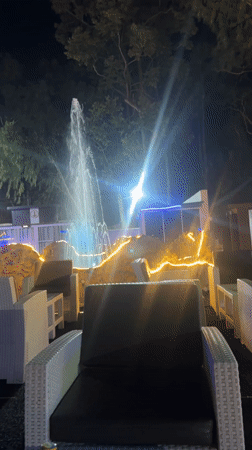 Illuminated fountain operates at night in Barakin Lerawi, Nigeria