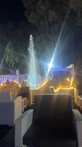 Illuminated fountain operates at night in Barakin Lerawi, Nigeria