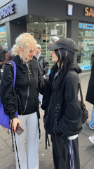 Two women spotted outside phone store in Cologne