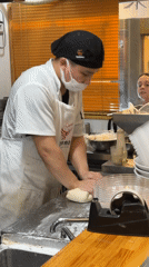 Chef hand-pulls noodles during lunch service at Kyoto restaurant