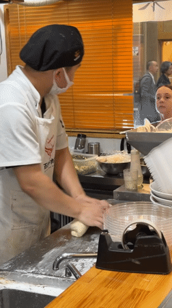 Chef hand-pulls noodles during lunch service at Kyoto restaurant