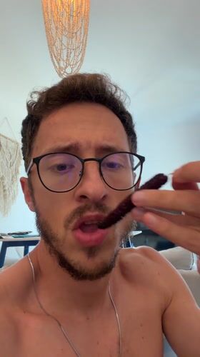 Man eating dark red food in decorated Cyprus home