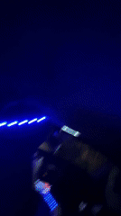 Person installs colorful LED lights in car interior, Bulgaria