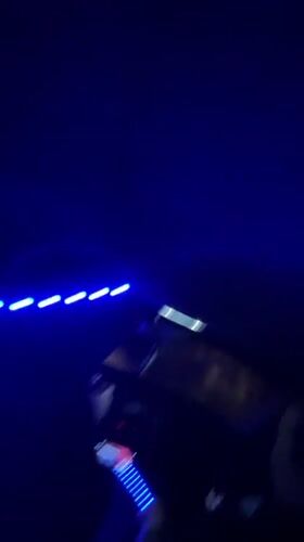 Person installs colorful LED lights in car interior, Bulgaria