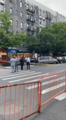 Red barriers block NYC crosswalk during street work