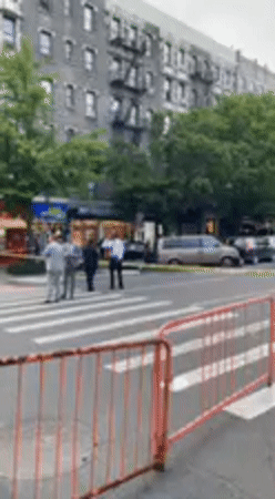 Red barriers block NYC crosswalk during street work