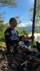 Motocross rider takes scenic break on Kintamani hillside
