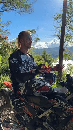 Motocross rider takes scenic break on Kintamani hillside