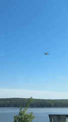 Photo session in industrial space captures helicopter over lake