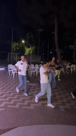 Nighttime outdoor dance performance in Isola delle Femmine