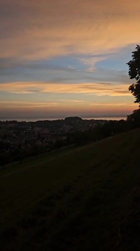 Sunset over St. Gallen from a hilltop vantage point