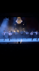 Sailor-costumed dancers perform for audience in Rusanovo, Russia