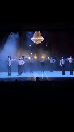 Sailor-costumed dancers perform for audience in Rusanovo, Russia
