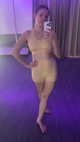 Woman practices pole dancing, takes selfies at Batumi studio