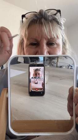 Woman documents morning routine with dog in French home