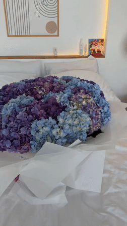 Bedroom decorated with hydrangea bouquet for celebration in Ubud