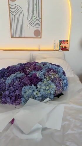 Bedroom decorated with hydrangea bouquet for celebration in Ubud