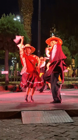 Traditional folk dancers perform on outdoor stage in Arequipa