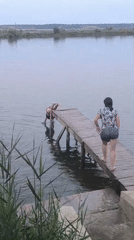 Summer afternoon at a Moldovan pier: swimming, jumping, and grilling