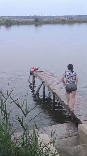 Summer afternoon at a Moldovan pier: swimming, jumping, and grilling