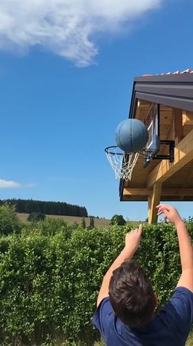 Backyard afternoon in Sulitsa: hoops, gardens, and a terrier