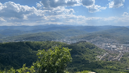 Sunny afternoon view captures Gabrovo nestled in Bulgarian hills