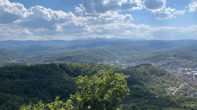 Sunny afternoon view captures Gabrovo nestled in Bulgarian hills
