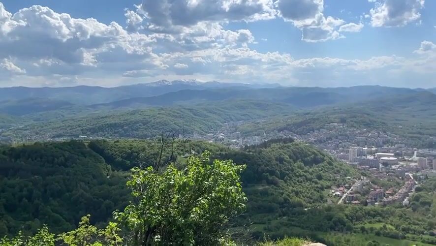 Sunny afternoon view captures Gabrovo nestled in Bulgarian hills