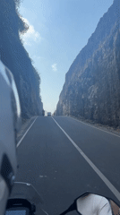 Riding Bali's coastal cliff road in Kuta Selatan