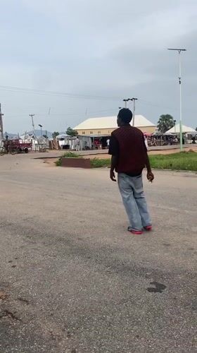Afternoon street life and nature details in Kuson, Nigeria