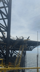 Helicopter lands on offshore oil rig in Adriatic Sea