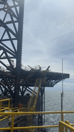 Helicopter lands on offshore oil rig in Adriatic Sea