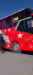 Decorated bus and loaded rickshaw spotted on Pakistan roadside