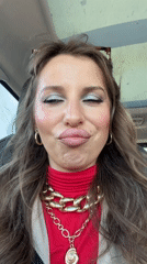 Woman photographed in car wearing red turtleneck in Bat Yam