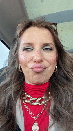 Woman photographed in car wearing red turtleneck in Bat Yam