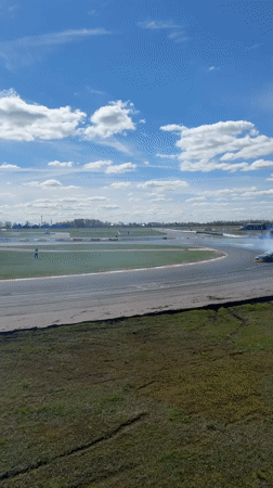Drift cars perform synchronized maneuvers on Russian race track