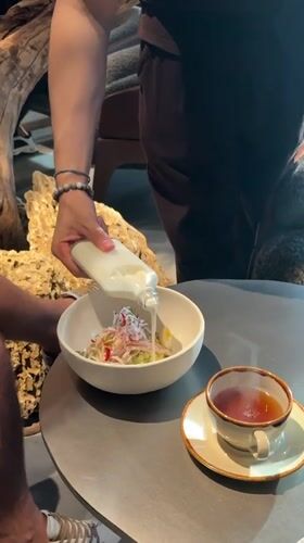 Tea and dressed salad at a Moscow restaurant table