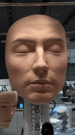Maison Margiela art installation with diving figures displayed in Dubai