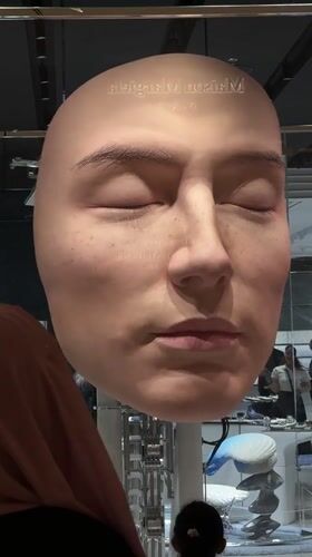 Maison Margiela art installation with diving figures displayed in Dubai