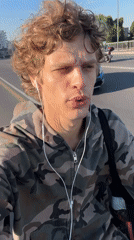 Skating and talking to camera through Milan streets