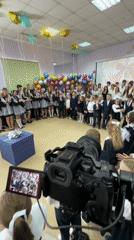 School celebration filmed in Krasnoyarsk with students and balloons
