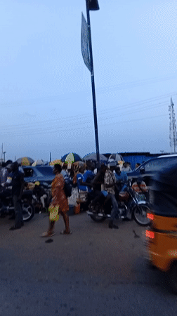 Evening street life documented in Ikeja, Nigeria marketplace district