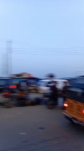 Evening street life documented in Ikeja, Nigeria marketplace district