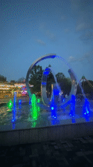 Colorful fountain lights up Rostov-on-Don amusement park at dusk