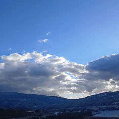 Rolling hills and cloudy skies captured in Peso da Régua