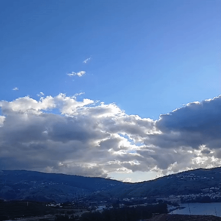 Rolling hills and cloudy skies captured in Peso da Régua
