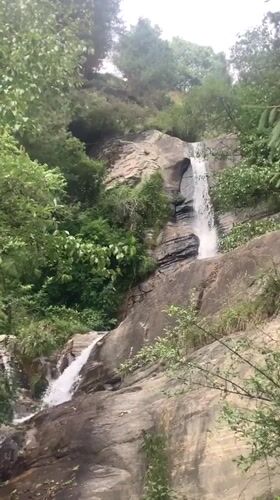 Waterfall shrine visit in Old Manali's forested hills